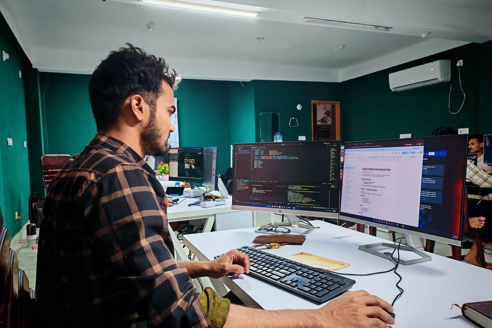Developer working on code in a modern office